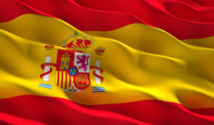 Bandera de España ondeando, reflejando la actualidad y Noticias España nacionales en temas de política, economía, y cultura en SpykPress.com.