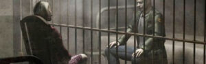 Escena de Silent Hill 2 con dos personajes separados por una reja, uno sentado en una cama y el otro en una silla, representando el horror psicológico en el nuevo juego de Silent Hill.